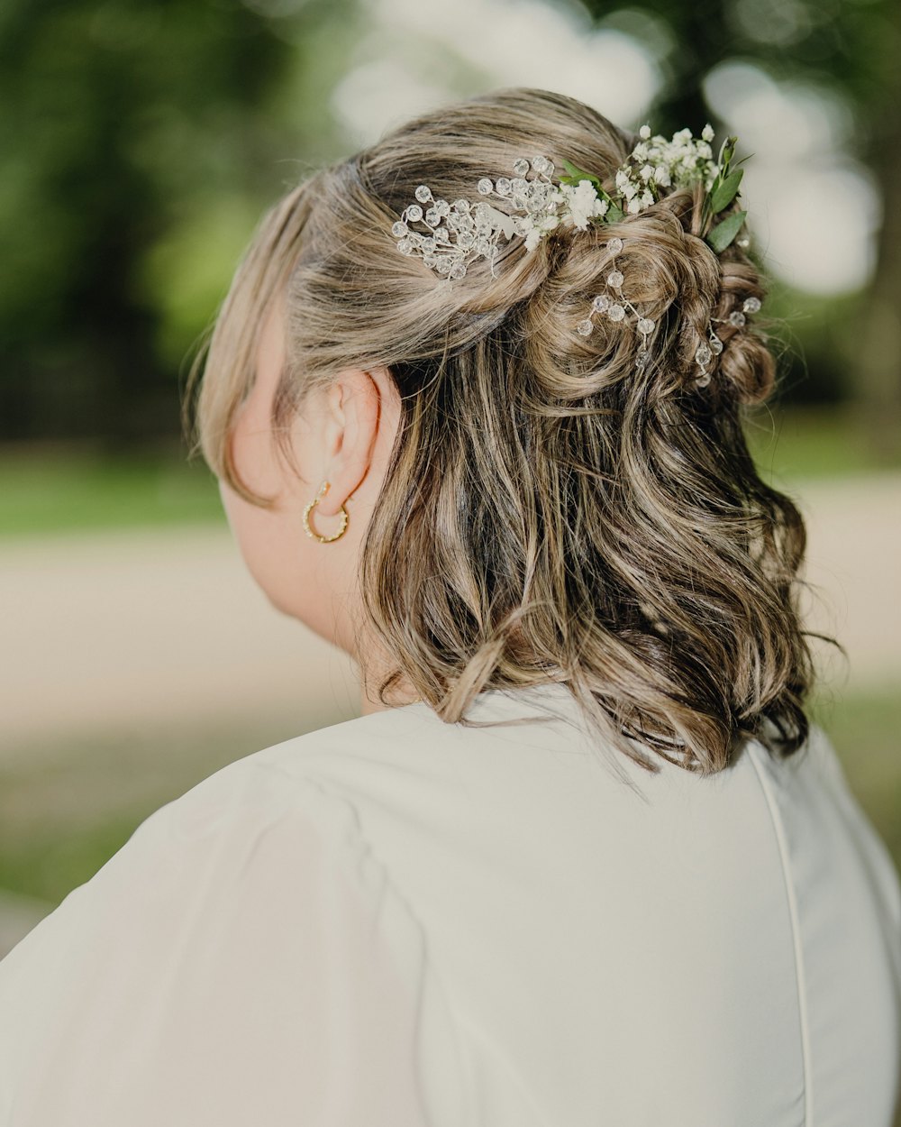 Soft updo finished with a floral hair accessory