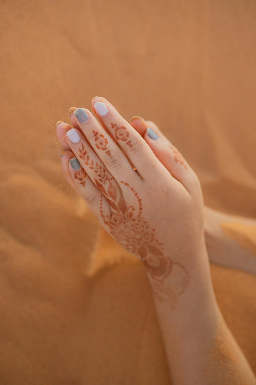 Hand decorated with a delicate white henna lace pattern